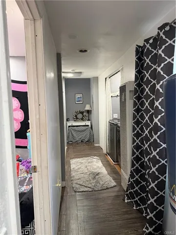 a kitchen with a refrigerator and a sink