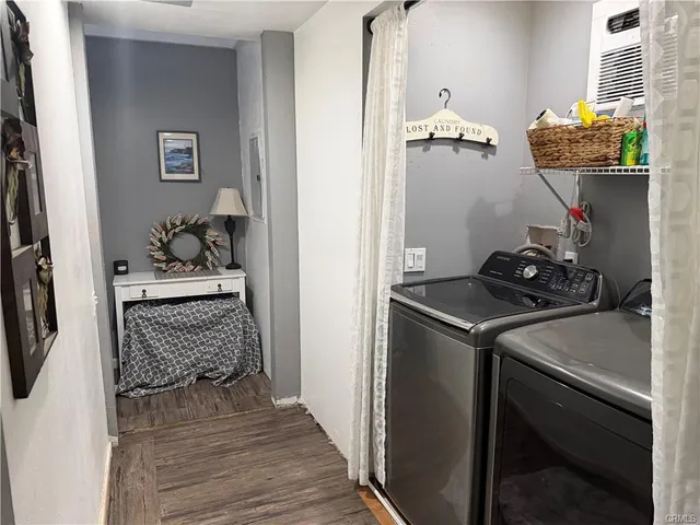 a bedroom with a bed and a mirror