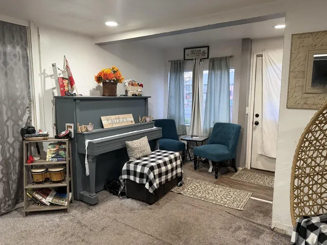a bedroom with furniture and a fireplace