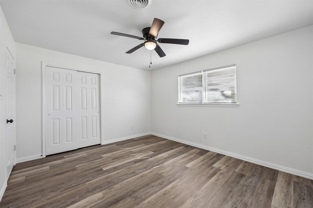 913 North Main Street Springtown, TX 76082 - Photo 13 of 25 a view of empty room with wooden floor