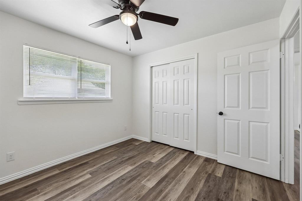 913 North Main Street Springtown, TX 76082 - Photo 14 of 25 a view of empty room with wooden floor and fan