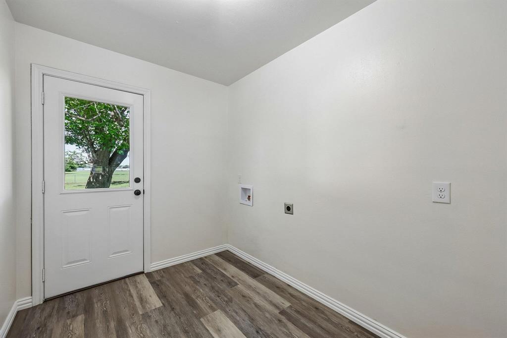 913 North Main Street Springtown, TX 76082 - Photo 20 of 25 a view of small space with wooden floor and a window
