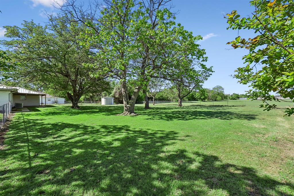 913 North Main Street Springtown, TX 76082 - Photo 22 of 25 a view of grassy field with benches