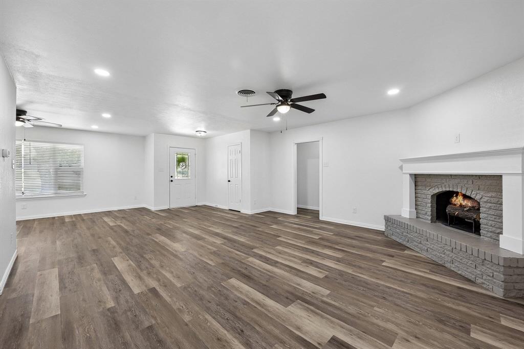 913 North Main Street Springtown, TX 76082 - Photo 9 of 25 a view of a livingroom with a fireplace and window
