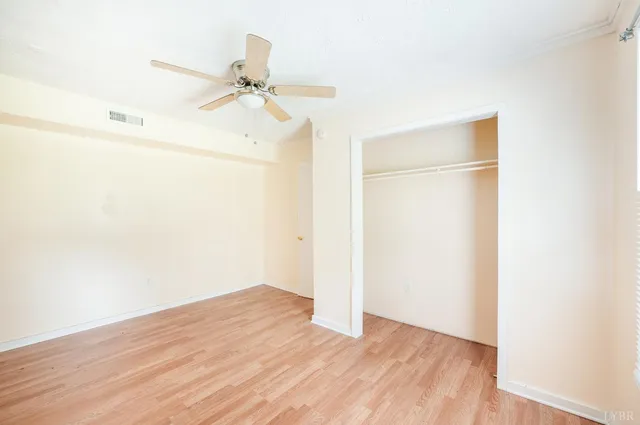 a kitchen with a refrigerator and a stove top oven