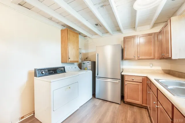 a view of a storage & utility room with wooden floor