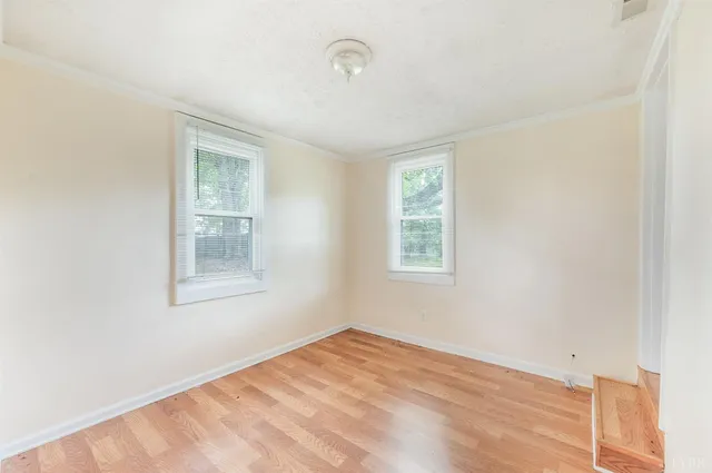 a view of hallway with wooden floor