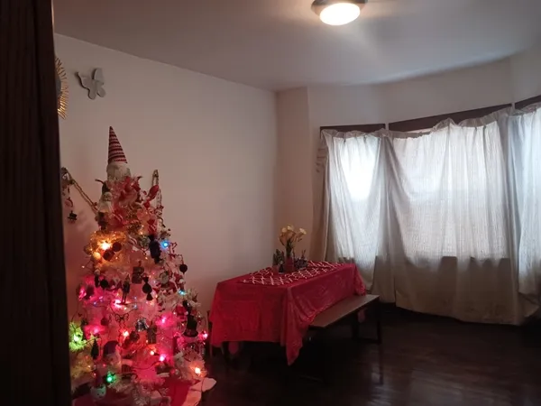 a room with a bed and a chandelier