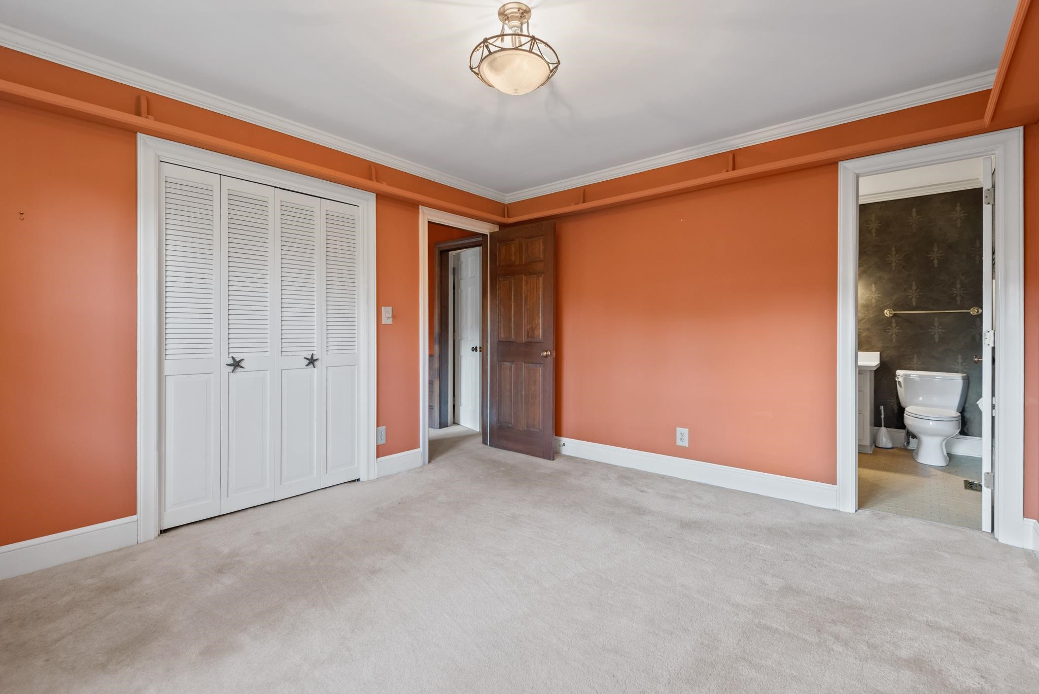 1704 Hunting Ridge Road Raleigh, NC 27615 - Photo 11 of 43 an empty room and chandelier fan