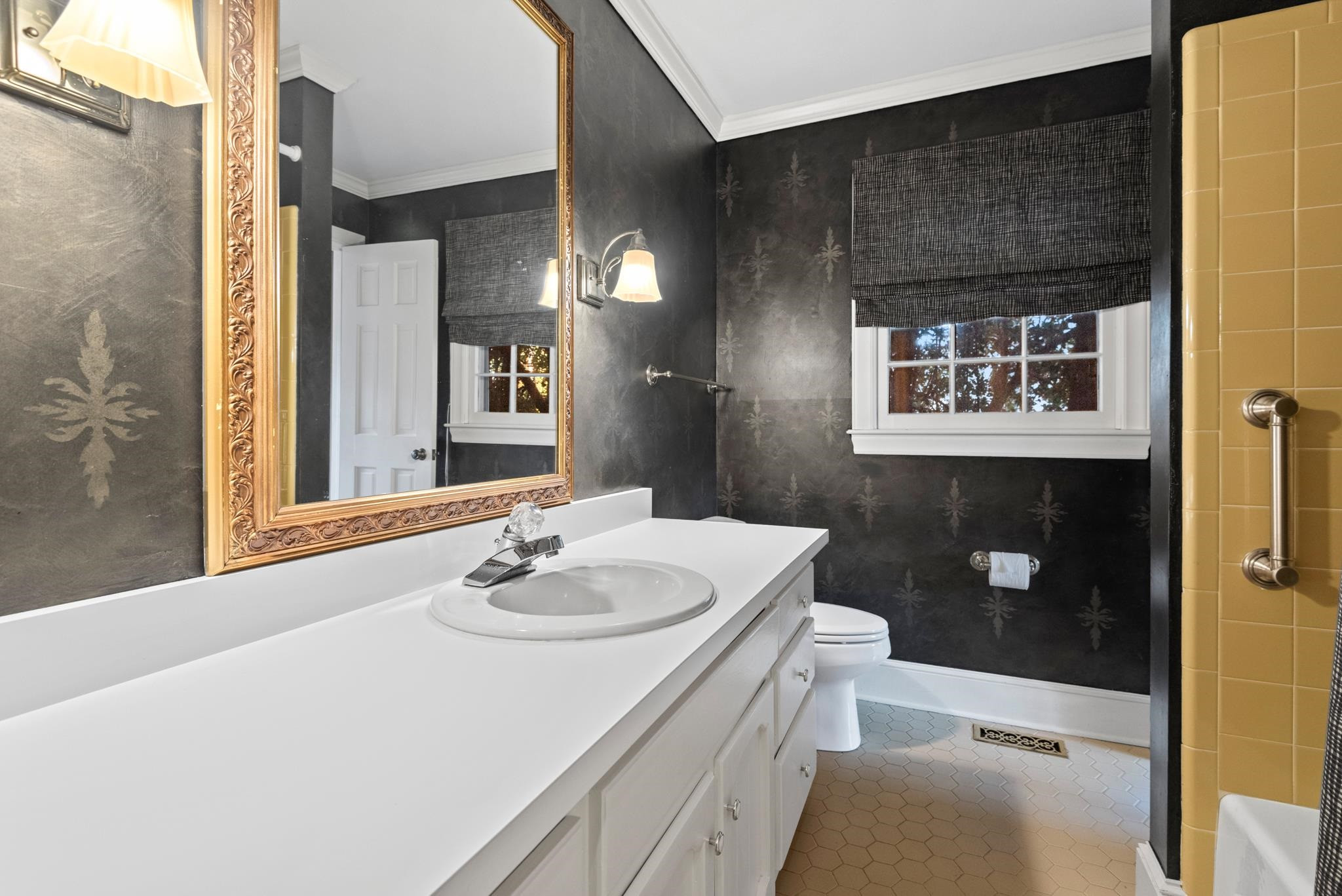 1704 Hunting Ridge Road Raleigh, NC 27615 - Photo 12 of 43 a bathroom with a sink a toilet and shower