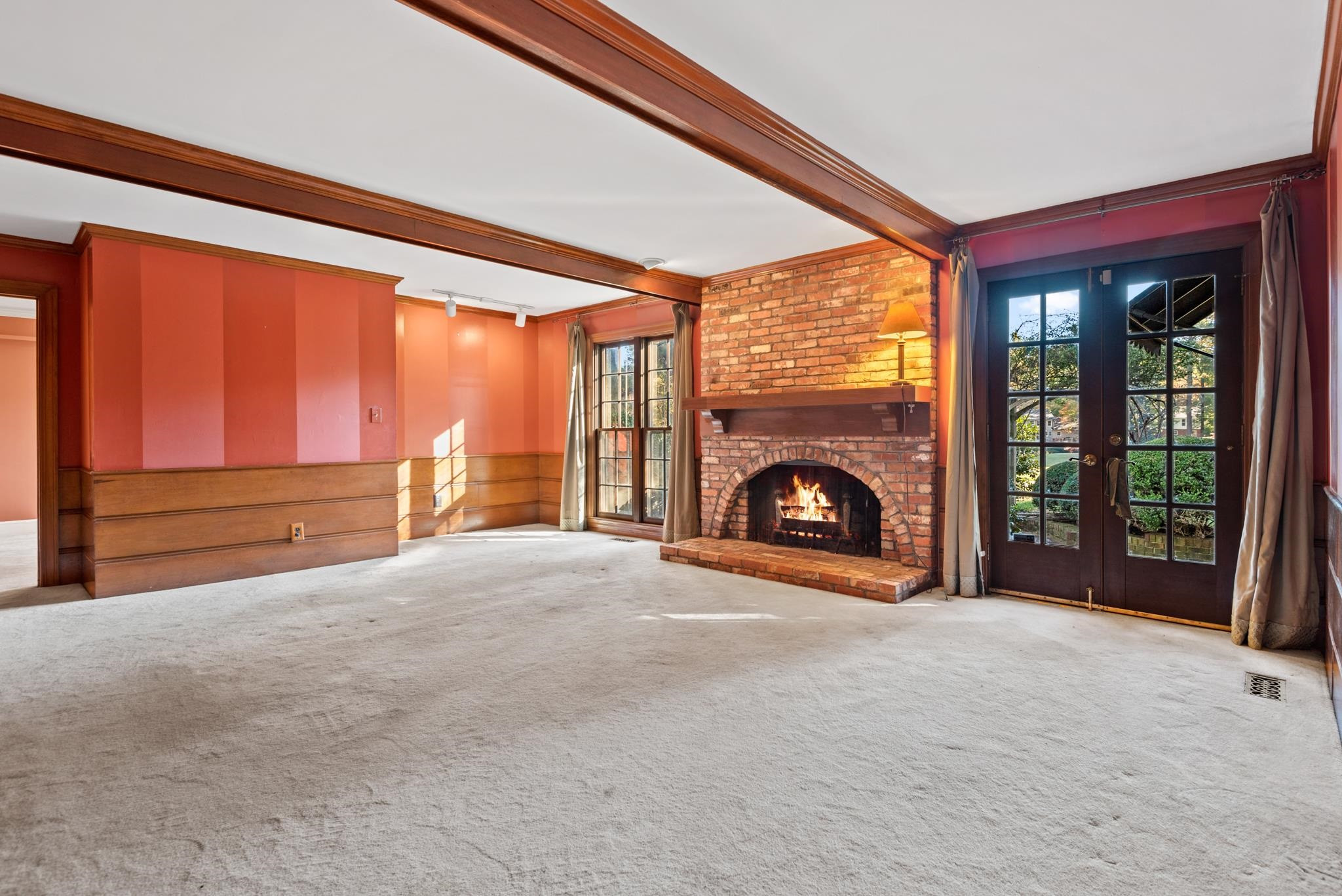 1704 Hunting Ridge Road Raleigh, NC 27615 - Photo 13 of 43 a view of an empty room with furniture and a fireplace