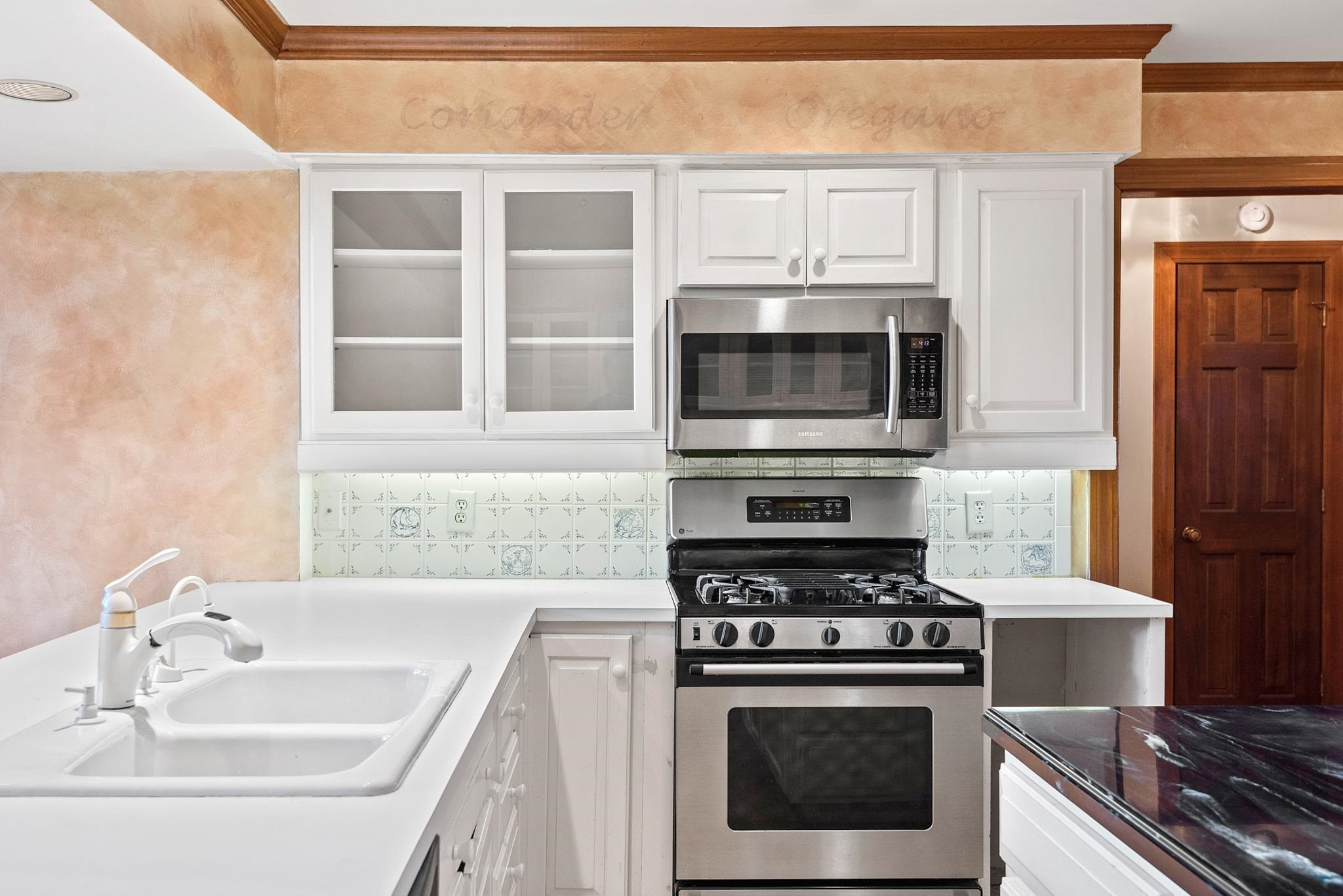 1704 Hunting Ridge Road Raleigh, NC 27615 - Photo 20 of 43 a kitchen with stainless steel appliances a stove and a sink