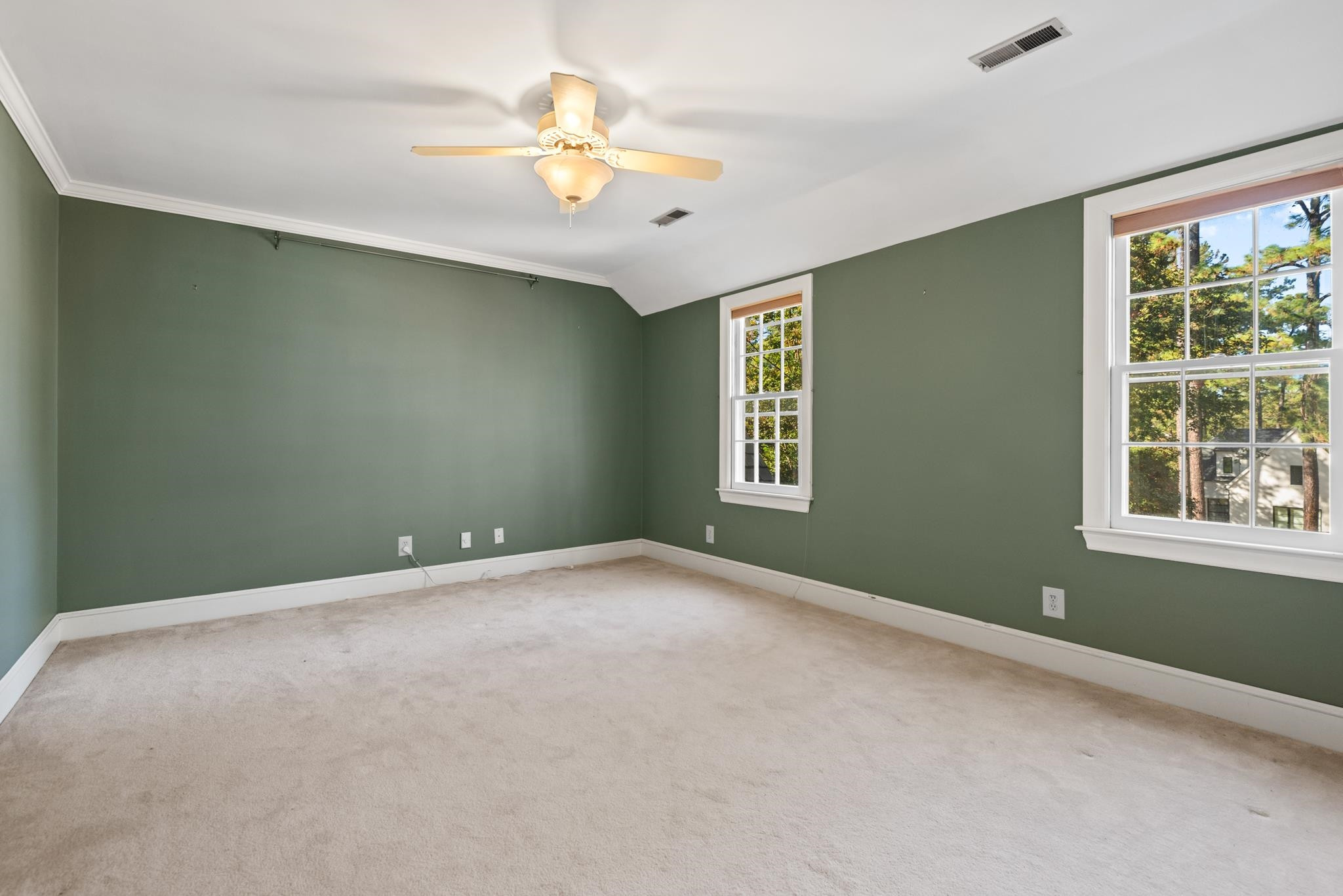 1704 Hunting Ridge Road Raleigh, NC 27615 - Photo 27 of 43 a view of an empty room with windows