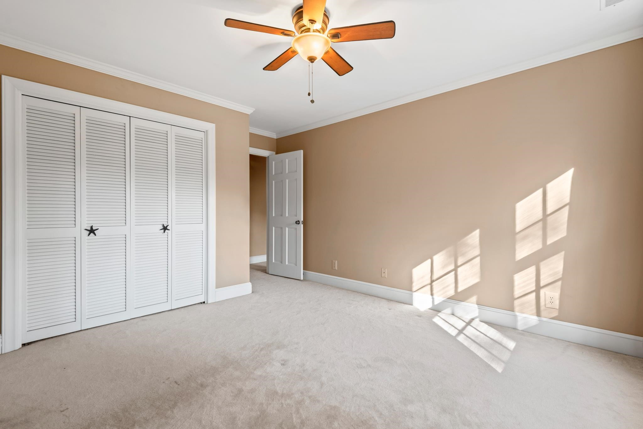 1704 Hunting Ridge Road Raleigh, NC 27615 - Photo 33 of 43 a view of a livingroom with a ceiling fan and window