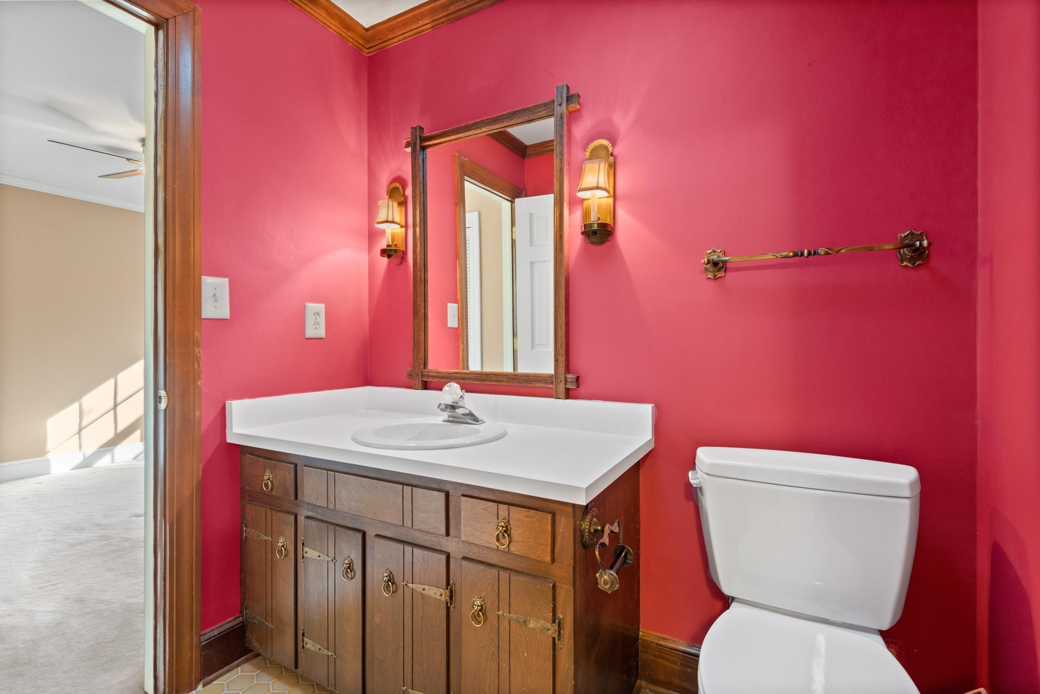 1704 Hunting Ridge Road Raleigh, NC 27615 - Photo 34 of 43 a bathroom with a granite countertop toilet sink and mirror