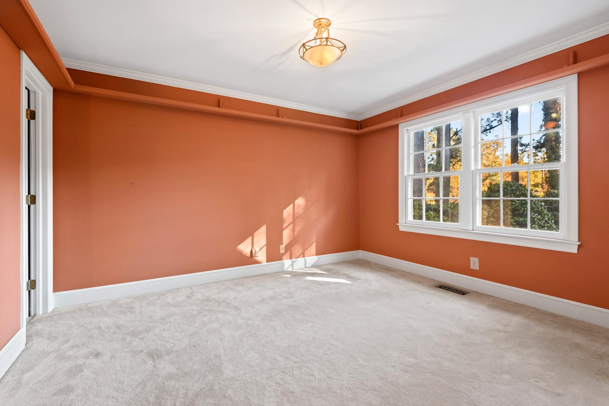 1704 Hunting Ridge Road Raleigh, NC 27615 - Photo 10 of 43 a view of an empty room with a window