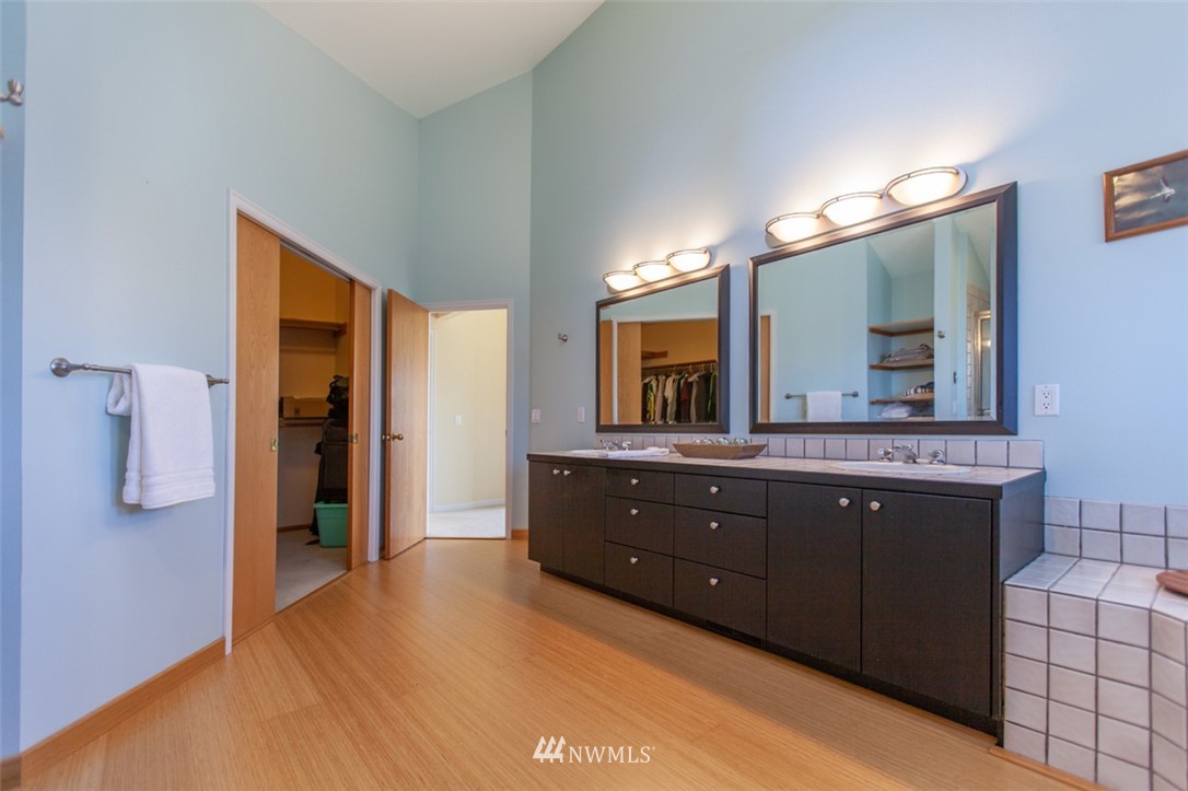 629 Briar Road Bellingham, WA 98225 - Photo 22 of 31 a spacious bathroom with a granite countertop sink and a mirror