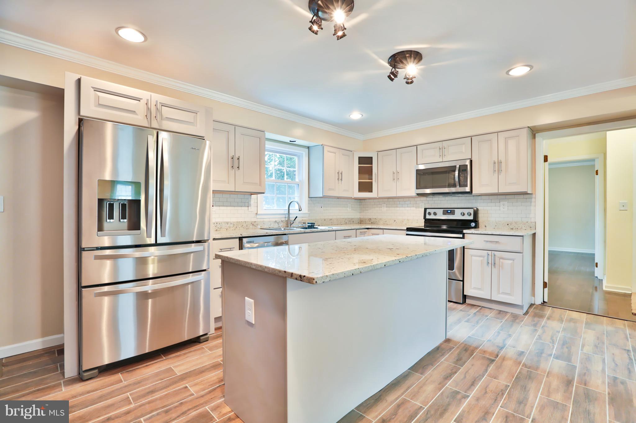 5017 Durham Road West Columbia, MD 21044 - Photo 10 of 26 Granite counters and stainless steel appliances