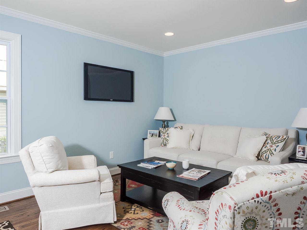 721 South State Street Raleigh, NC 27601 - Photo 2 of 25 a living room with furniture and a flat screen tv