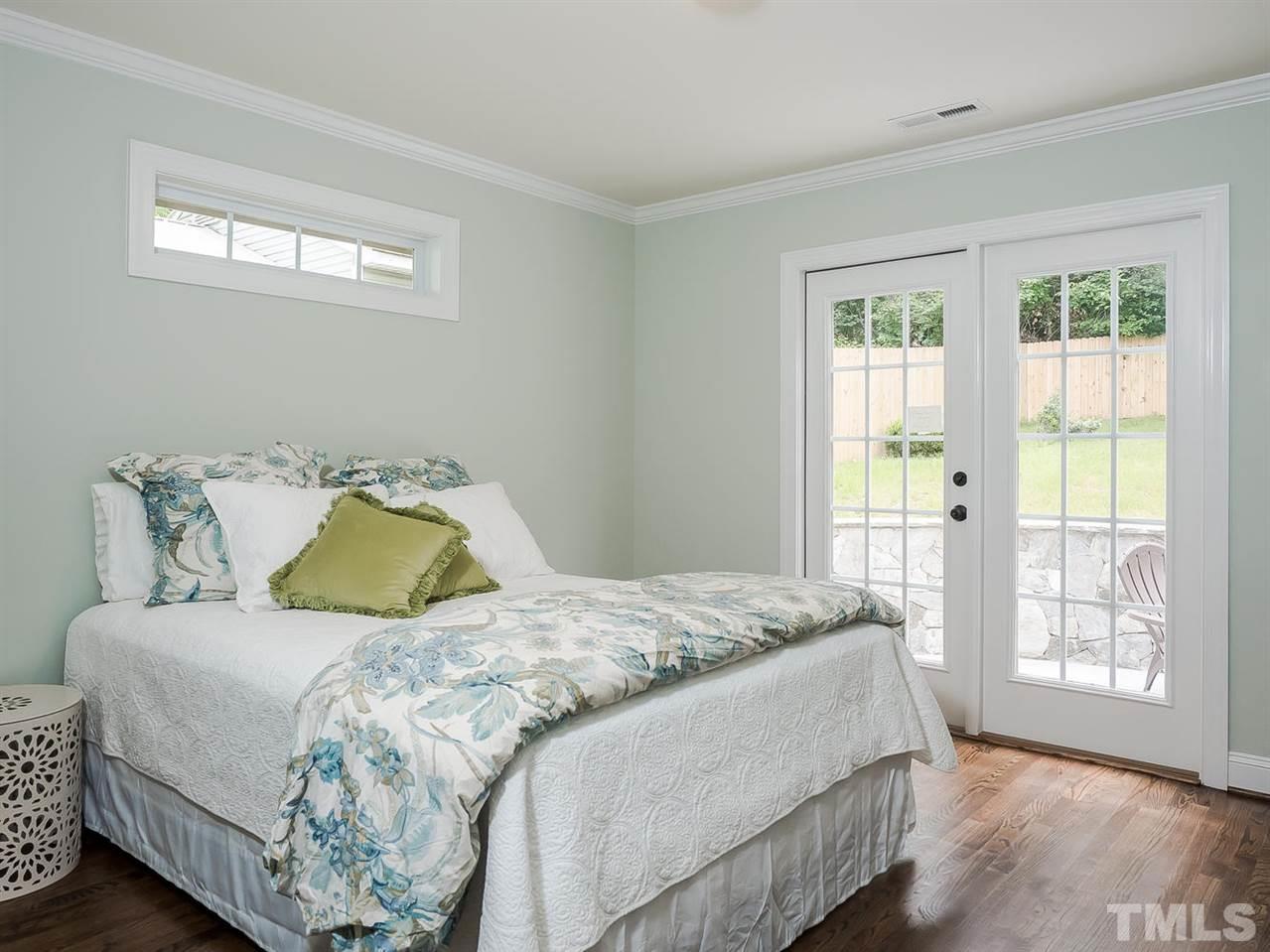 721 South State Street Raleigh, NC 27601 - Photo 11 of 25 a bedroom with a bed and window