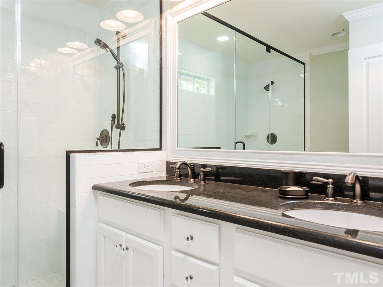 721 South State Street Raleigh, NC 27601 - Photo 12 of 25 a bathroom with a sink and a mirror