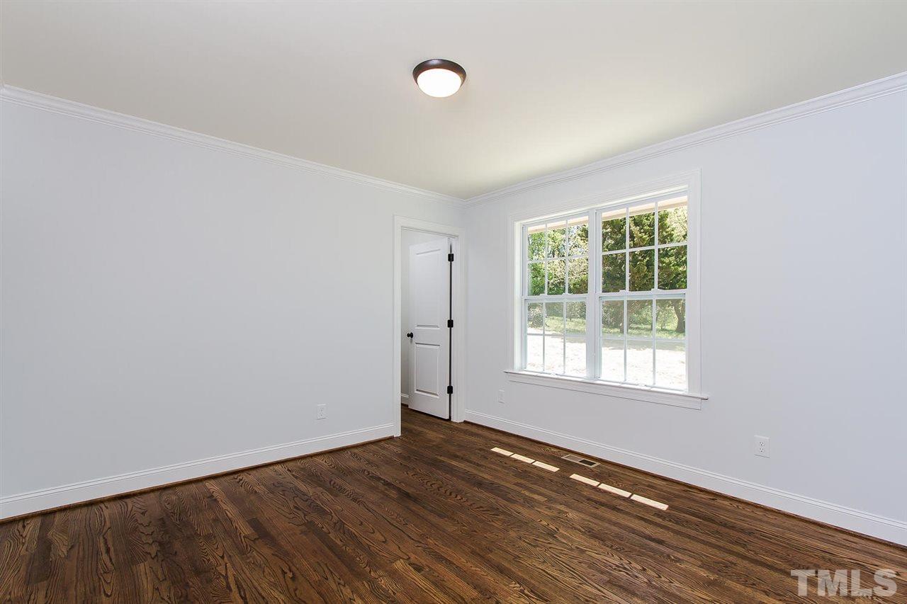 721 South State Street Raleigh, NC 27601 - Photo 14 of 25 an empty room with wooden floor and windows