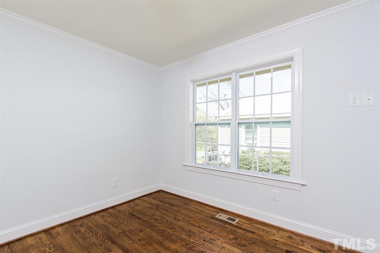 721 South State Street Raleigh, NC 27601 - Photo 17 of 25 an empty room with wooden floor and windows