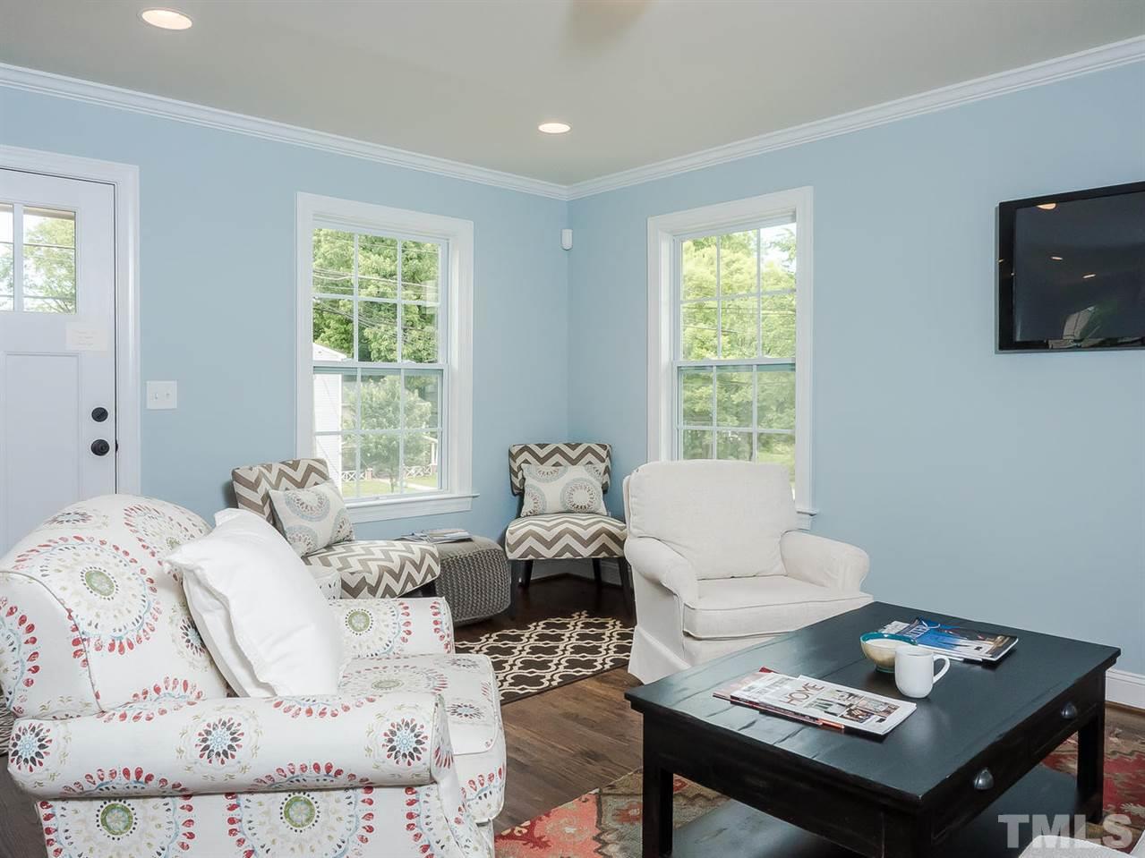 721 South State Street Raleigh, NC 27601 - Photo 3 of 25 a bed room with a bed and a window