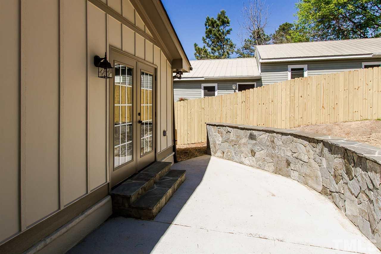 721 South State Street Raleigh, NC 27601 - Photo 24 of 25 a view of a house with a wooden bench