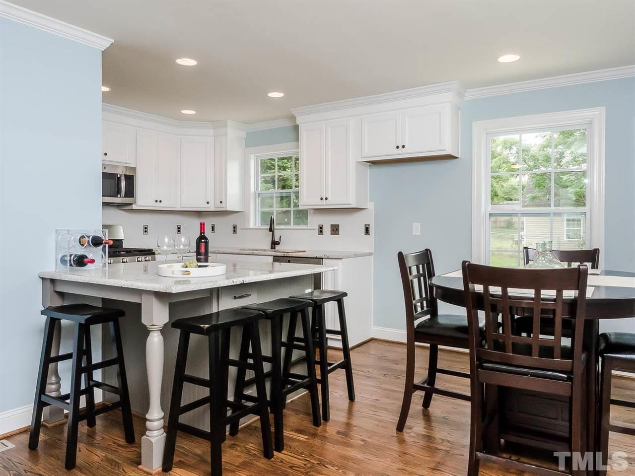 721 South State Street Raleigh, NC 27601 - Photo 5 of 25 a view of a dining room with furniture and wooden floor