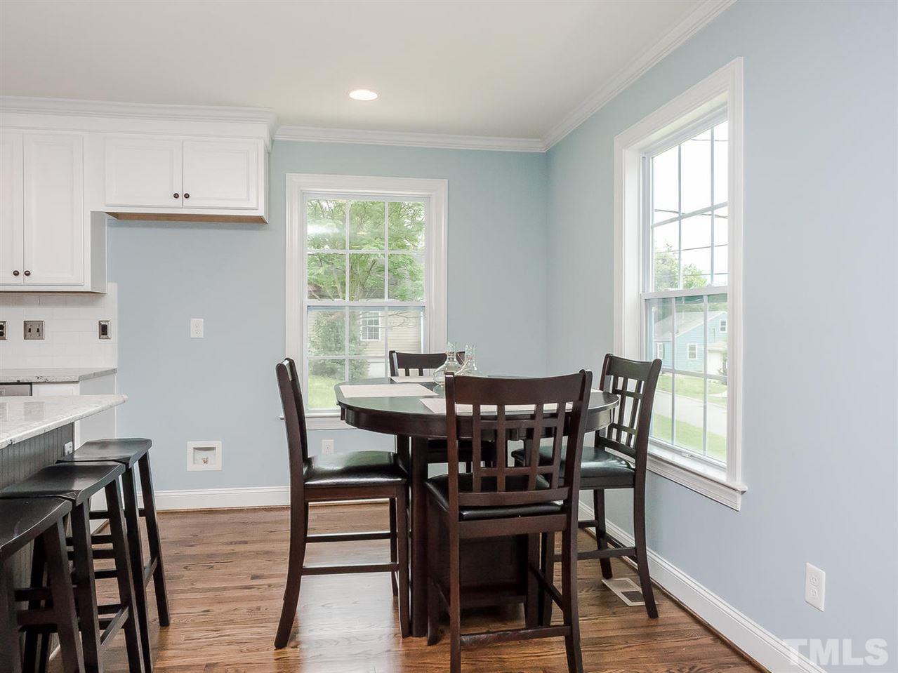 721 South State Street Raleigh, NC 27601 - Photo 10 of 25 a view of a dining room with furniture and wooden floor