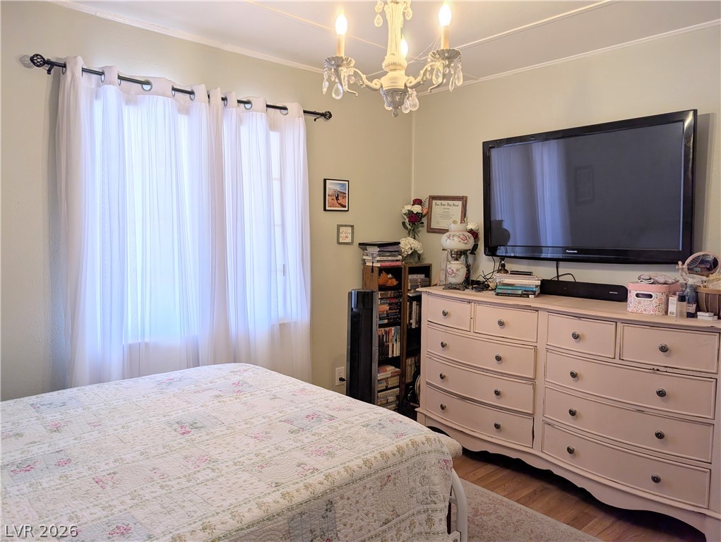 107 Rowan Drive Caliente, NV 89008 - Photo 12 of 23 This cozy bedroom offers a tranquil retreat with soft lighting and elegant details.