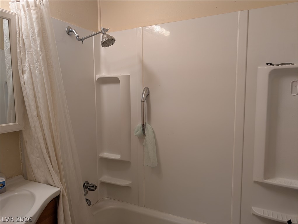 107 Rowan Drive Caliente, NV 89008 - Photo 15 of 23 This clean and functional bathroom features a shower-tub combination, ideal for everyday routines.