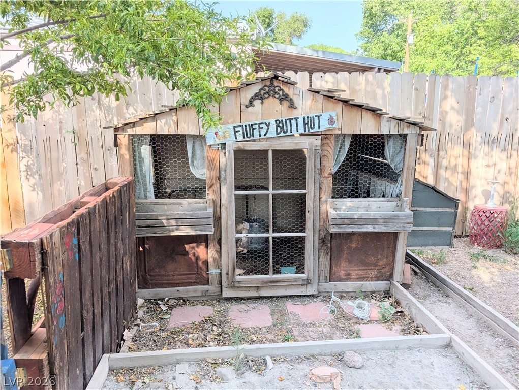 107 Rowan Drive Caliente, NV 89008 - Photo 19 of 23 This charming backyard structure offers a unique and rustic aesthetic.