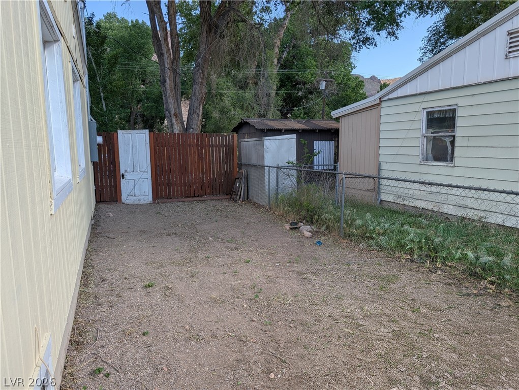 107 Rowan Drive Caliente, NV 89008 - Photo 23 of 23 This property features a spacious yard and various exterior structures.