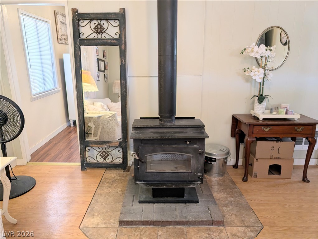 107 Rowan Drive Caliente, NV 89008 - Photo 5 of 23 This inviting space features a classic wood-burning fireplace, offering warmth and character.