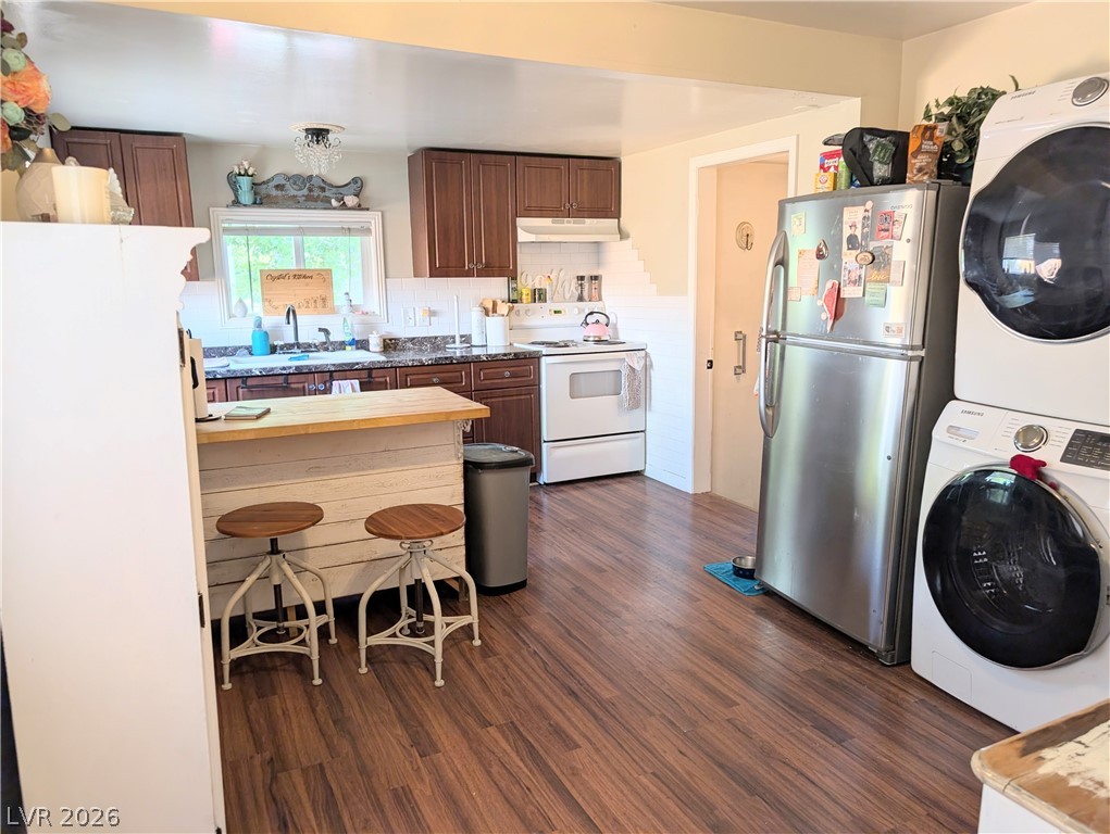 107 Rowan Drive Caliente, NV 89008 - Photo 6 of 23 This spacious kitchen offers a functional layout with ample counter space and abundant natural light.