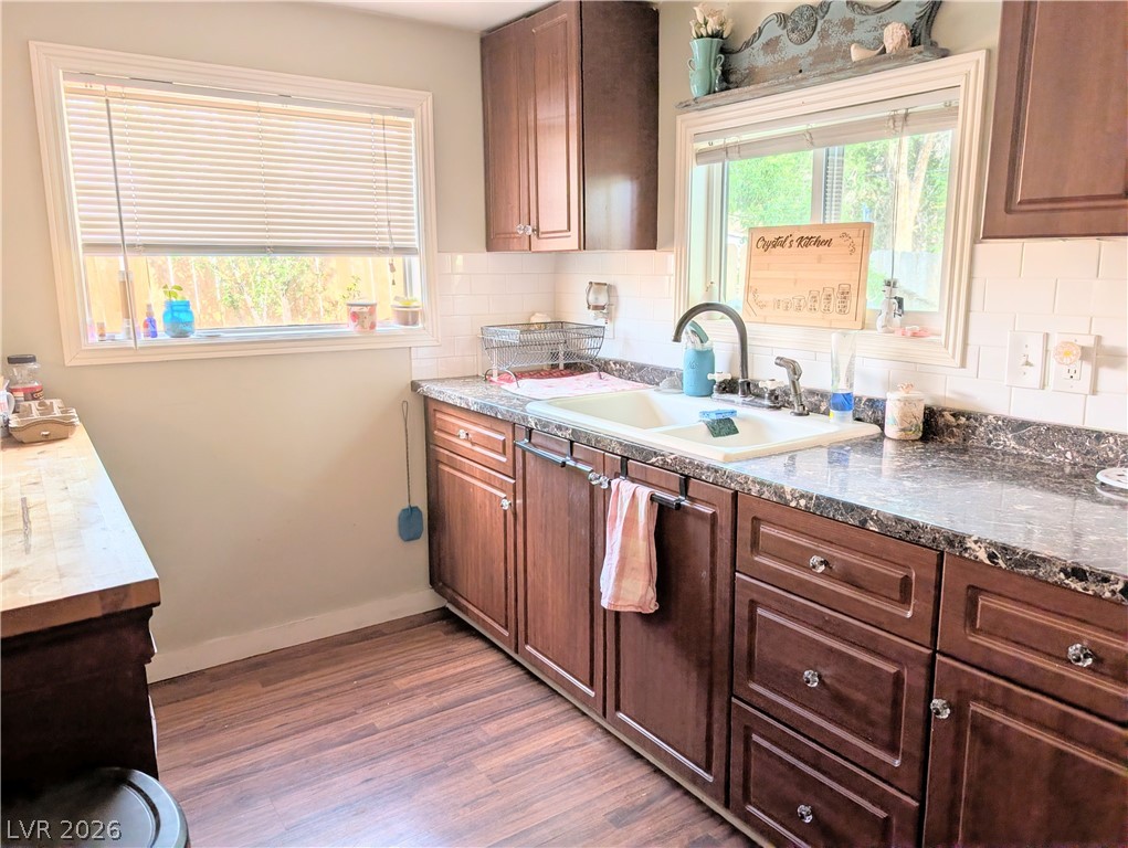 107 Rowan Drive Caliente, NV 89008 - Photo 7 of 23 This kitchen offers practical counter space and storage, ideal for everyday meal preparation.