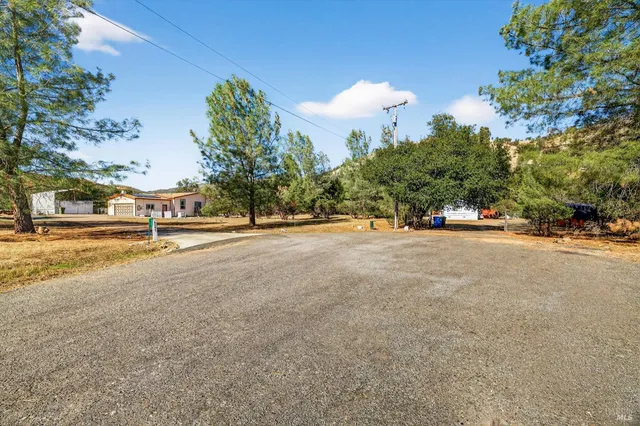 an aerial view of residential houses and outdoor space