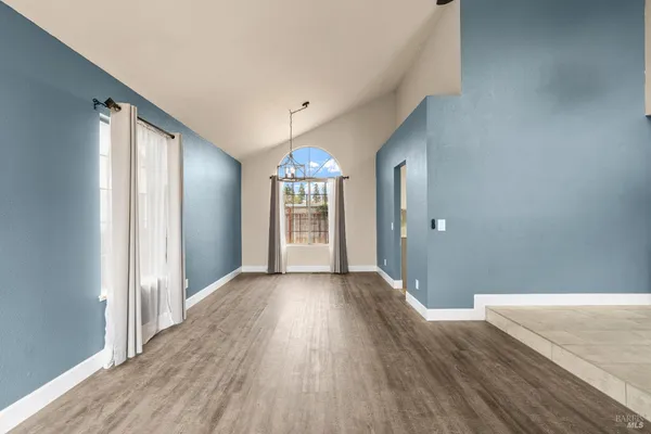 a view of a livingroom with wooden floor