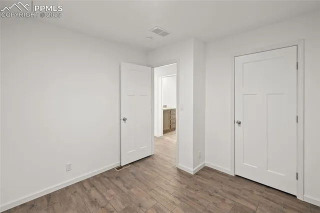 a bathroom with a granite countertop tub sink and toilet