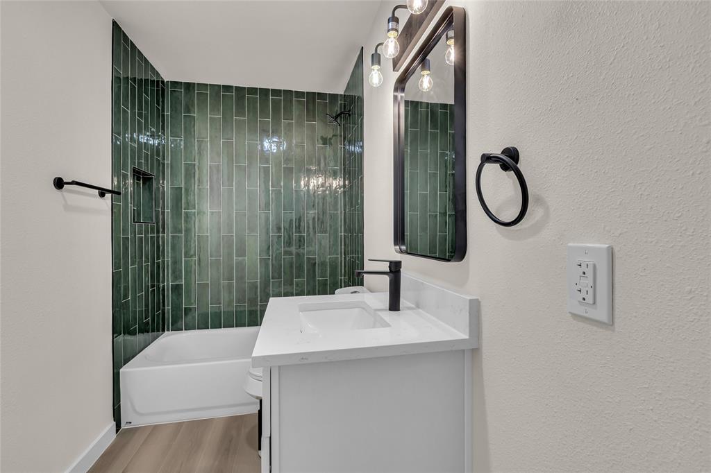 913 Roaming Rd Drive Allen, TX 75002 - Photo 15 of 21 a bathroom with a sink a toilet and shower