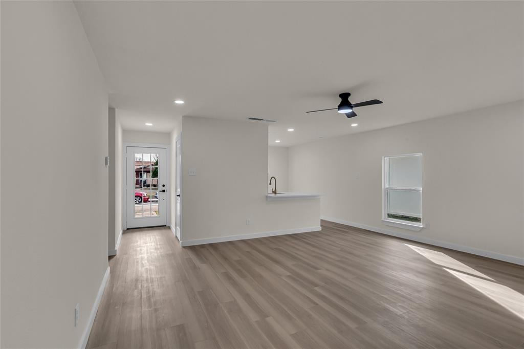 913 Roaming Rd Drive Allen, TX 75002 - Photo 4 of 21 wooden floor in an empty room with a window