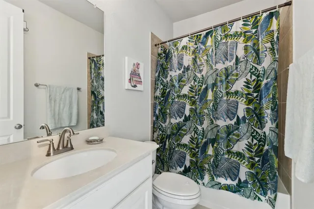 a bathroom with a toilet and a sink