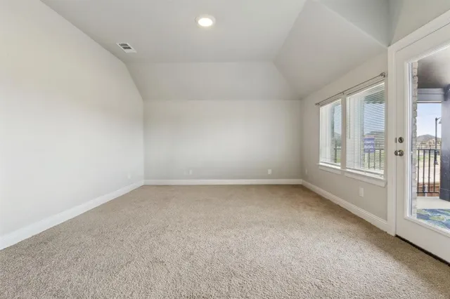 an empty room with a empty space and windows