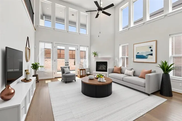 a living room with furniture a fireplace and a flat screen tv