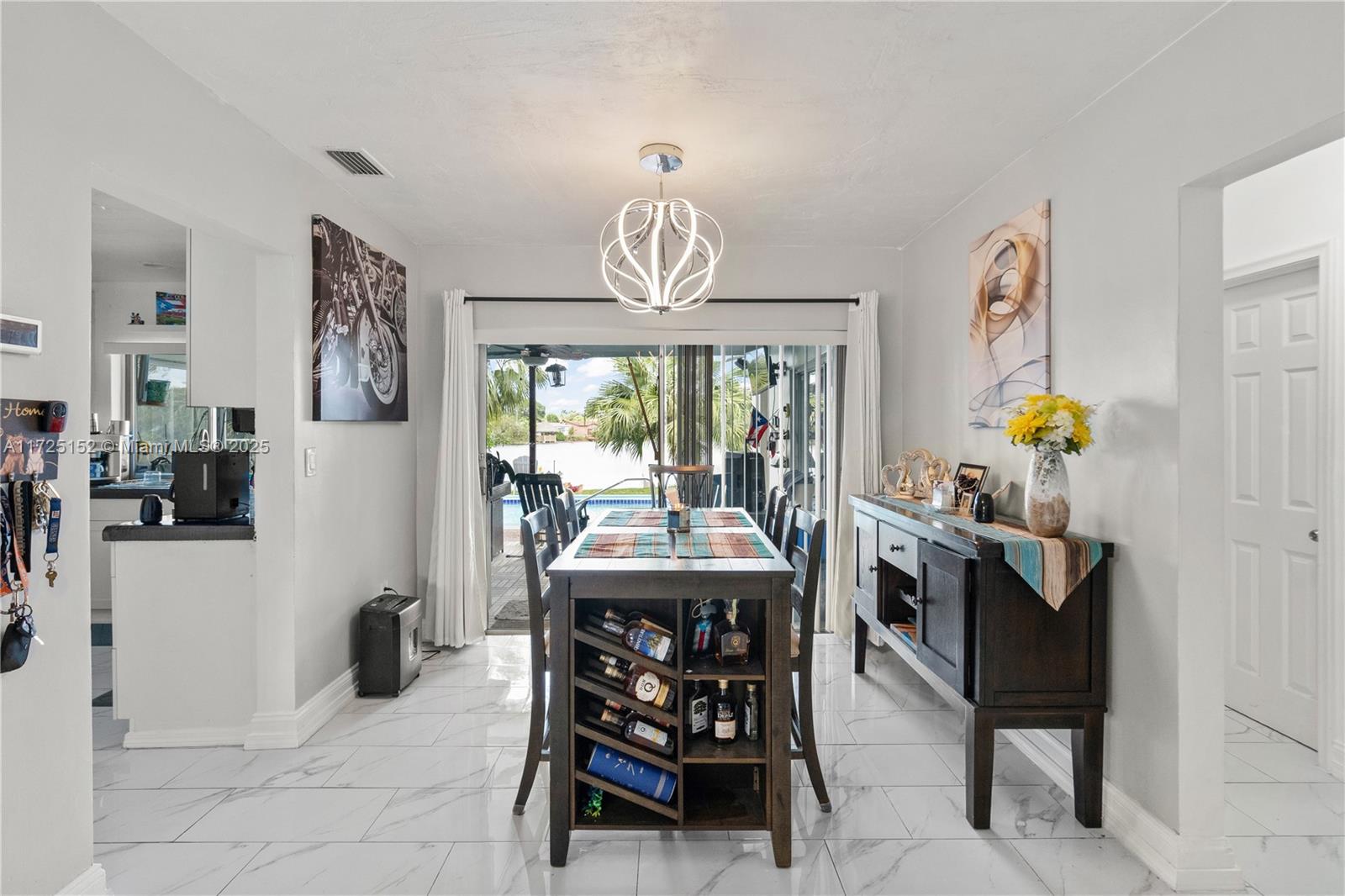 7271 Sunset Strip Sunrise, FL 33313 - Photo 16 of 45 a view of a dining room with furniture window and outside view