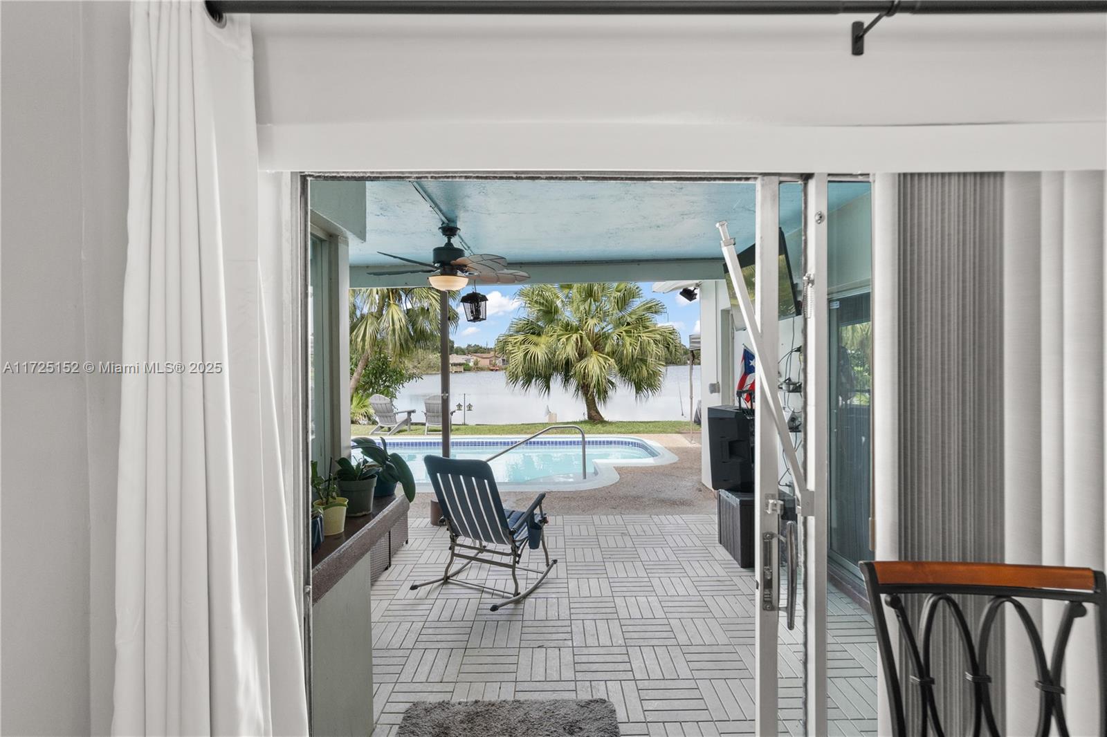 7271 Sunset Strip Sunrise, FL 33313 - Photo 23 of 45 a living room with furniture and a large window