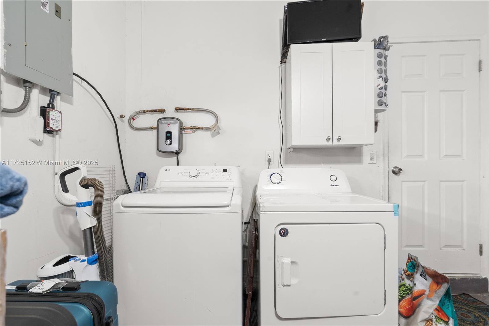 7271 Sunset Strip Sunrise, FL 33313 - Photo 25 of 45 a utility room with dryer and washer
