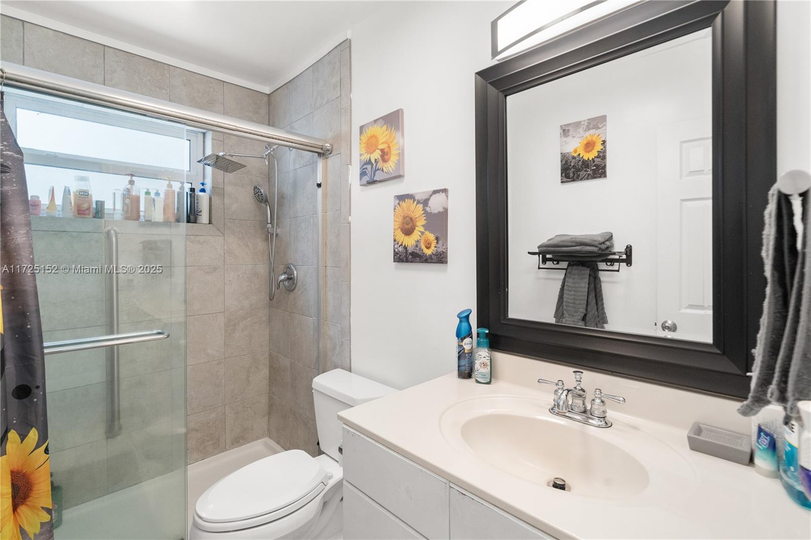 7271 Sunset Strip Sunrise, FL 33313 - Photo 26 of 45 a bathroom with a sink a toilet and shower